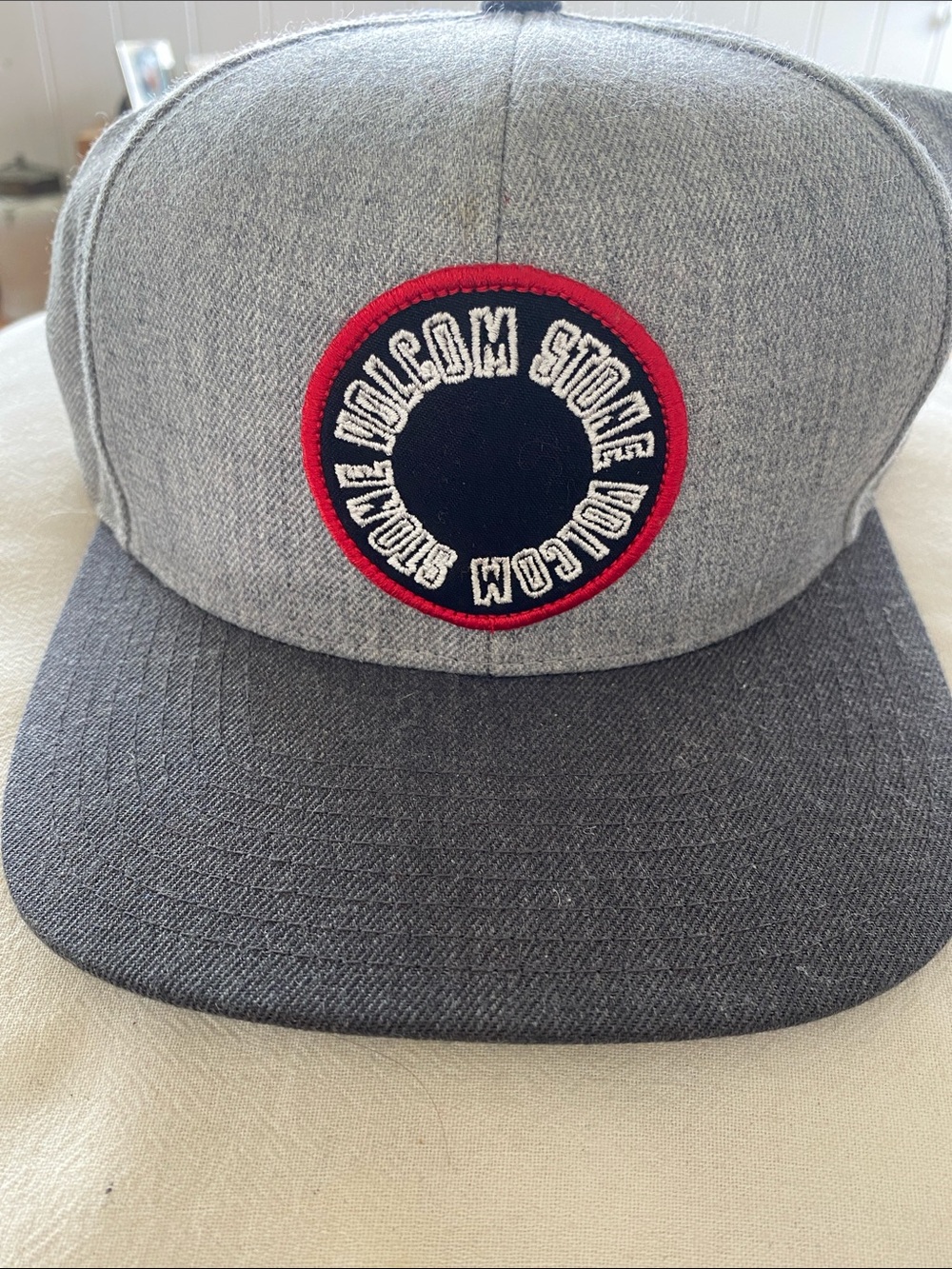 Volcom Grey Snapback Hat with Red Ring Patch. grey twill
